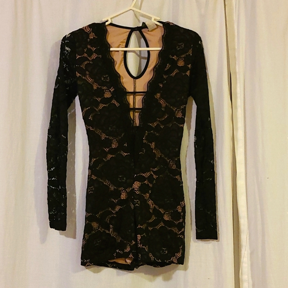 Lacy black and nude body suit